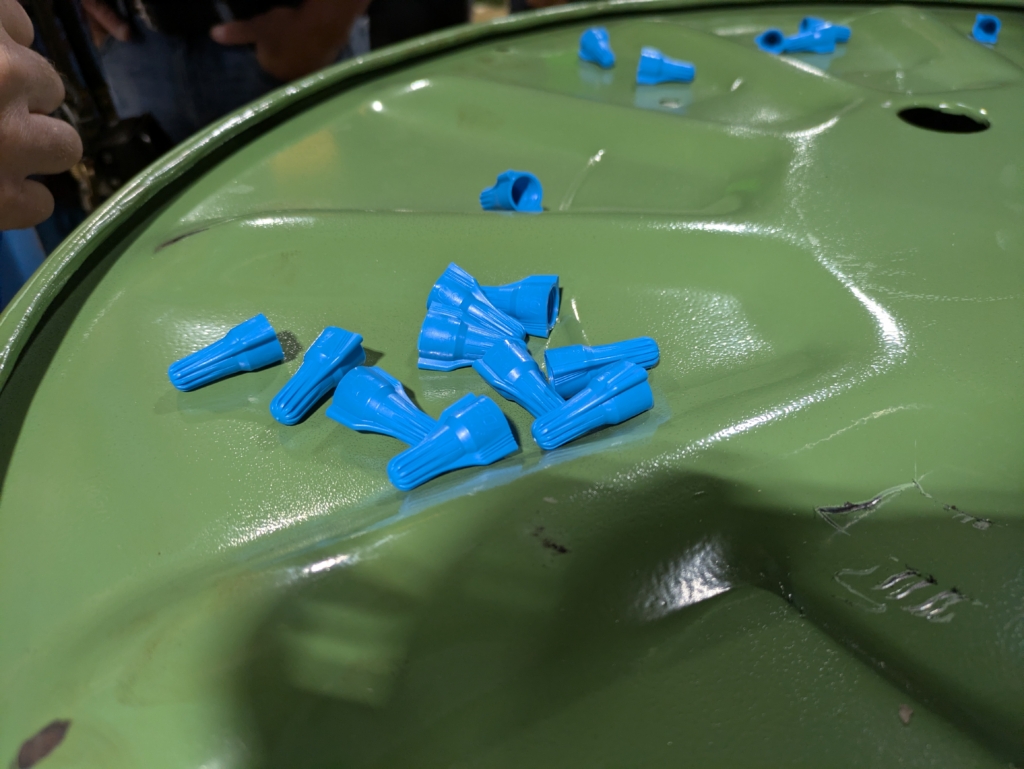 Blue twisting wire nut connectors, still warm after being molded