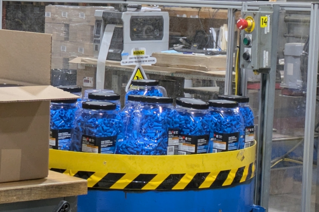 Blue wire nuts packaged in jars
