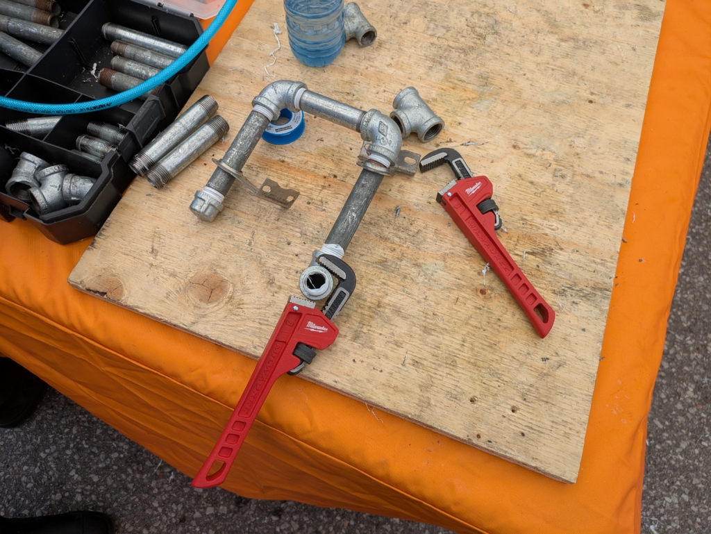 Two Milwaukee pipe wrenches used for tightening my installation