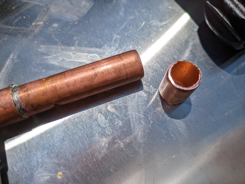 My first copper pipe cutting experience. You can see the failure at the left where I tightened the pipe cutter too tightly causing the pipe to get squished, resulting in a failed cut.