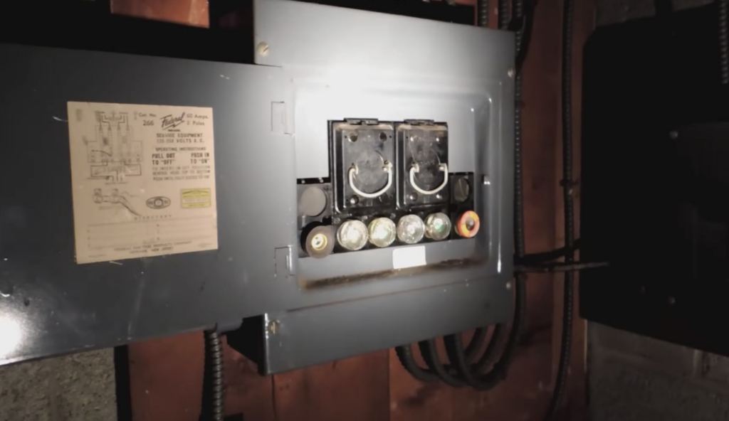 Fuse box with fuses in an older home