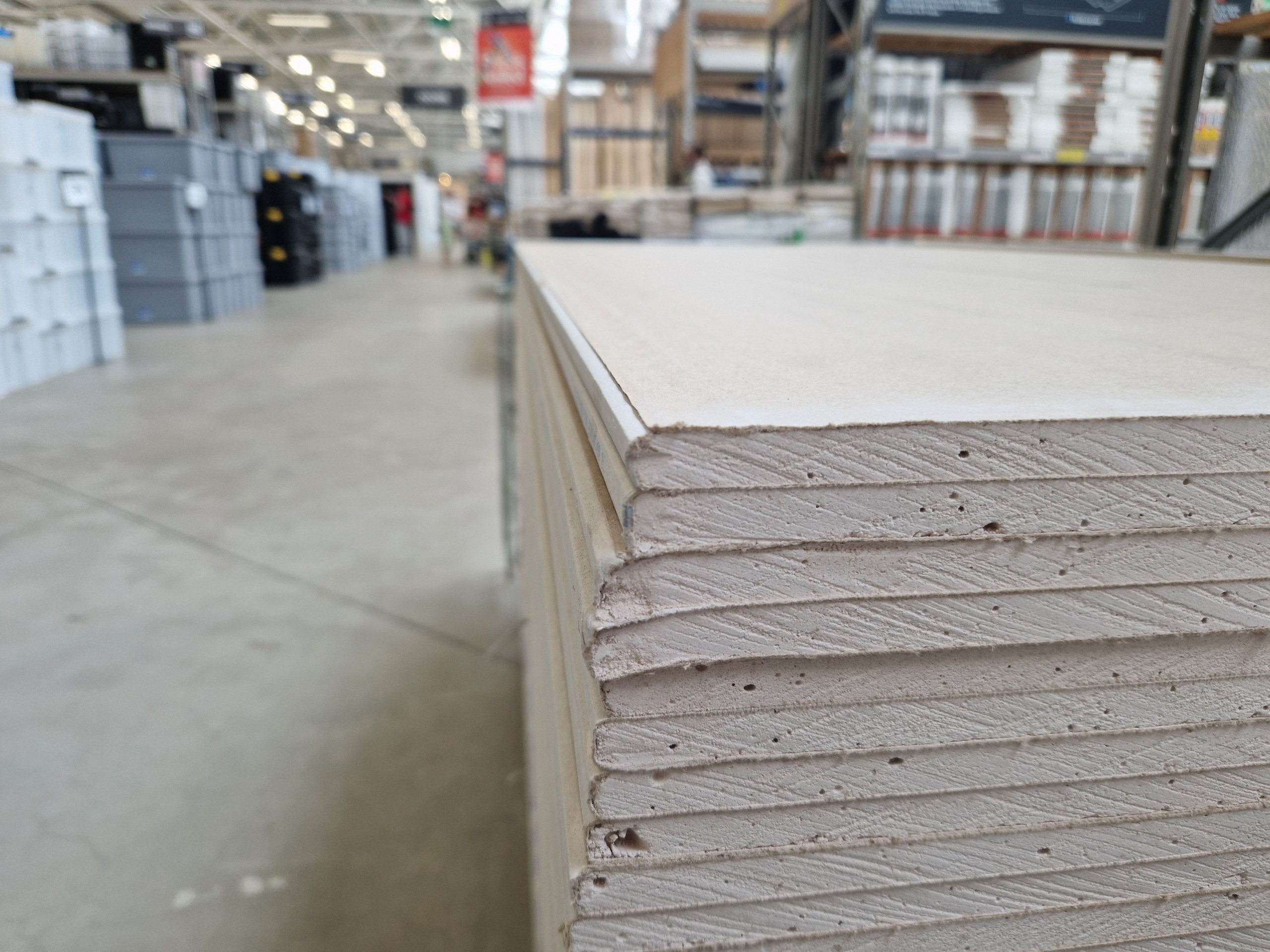 Stack of drywall boards. Photo by Pablo Fernandez (Pexels)